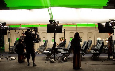 actors on film set airplane